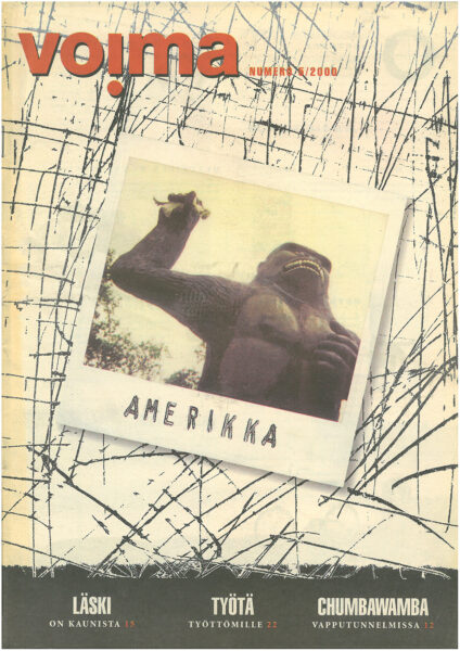 Lehden kannessa polaroid-kuva gorillapatsaasta, joka pitelee käsissään nukkea. Teksti "Amerikka" polaroidin alakulmassa.