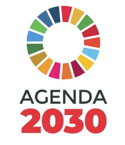 Logo, jossa teksti "Agenda 2030" ja eri värisistä palikoista muodostuva ympyrä.