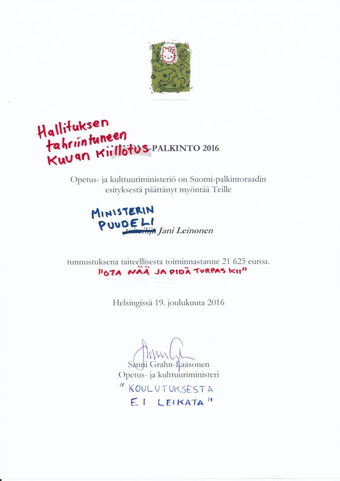 Ja näin. Parilla sanalla ministeriön myöntämä Suomi-palkinto muuttui ministerin ja ministeriön työtä kritisoivaksi taideteokseksi.